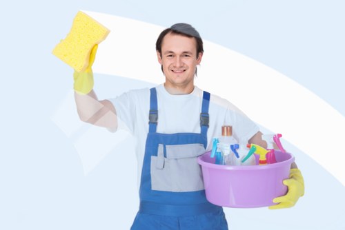 Professional cleaners sanitising a Kensington workplace kitchen and washroom