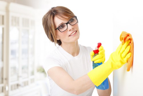 Local cleaner working in a Kensington flat with careful attention to access and surfaces