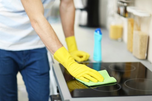 Cleaner working in a Kensington residential property during a move out clean