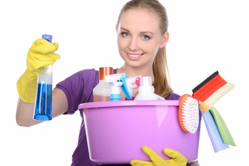 Technician performing deep sofa cleaning in a Kensington flat